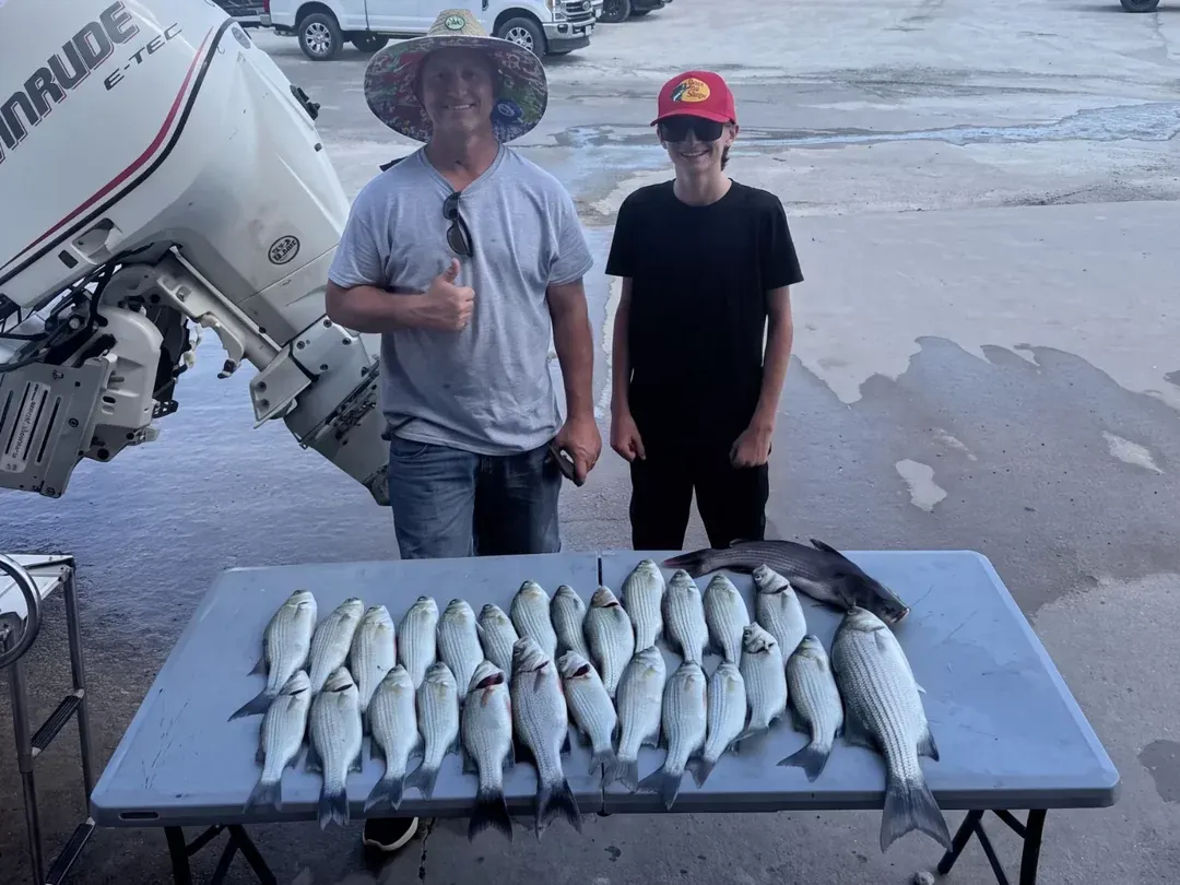 Anglers with a mixed catch on the cleaning table at Lake Bridgeport