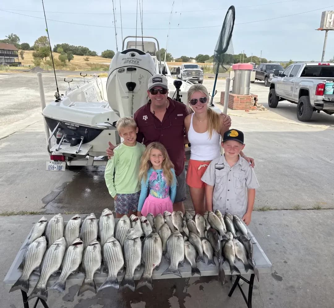 Family with their catch after a morning trip on Lake Bridgeport