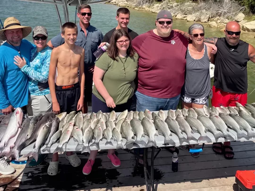 Group of anglers on the dock with their catch after a Lake Bridgeport trip