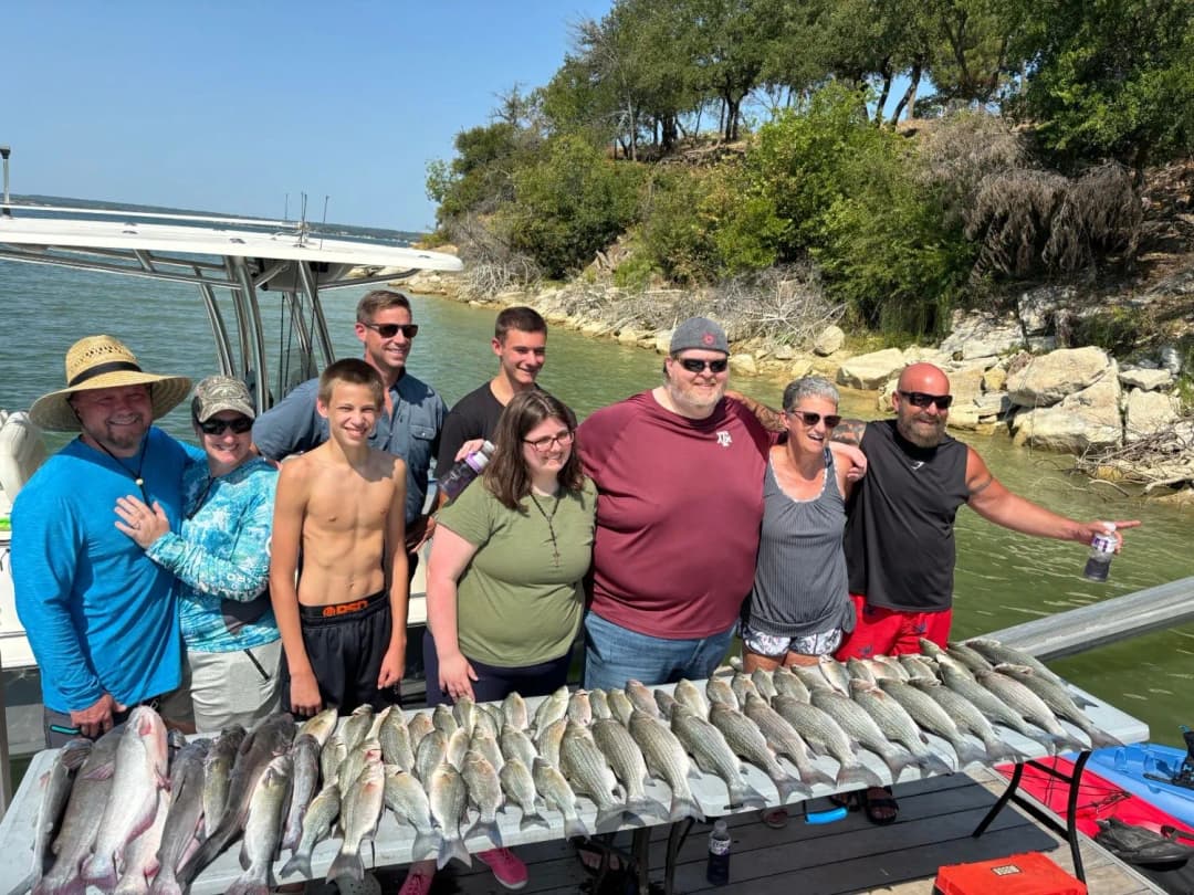 Group with their catch of sand bass, hybrid stripers and catfish at the Lake Bridgeport dock